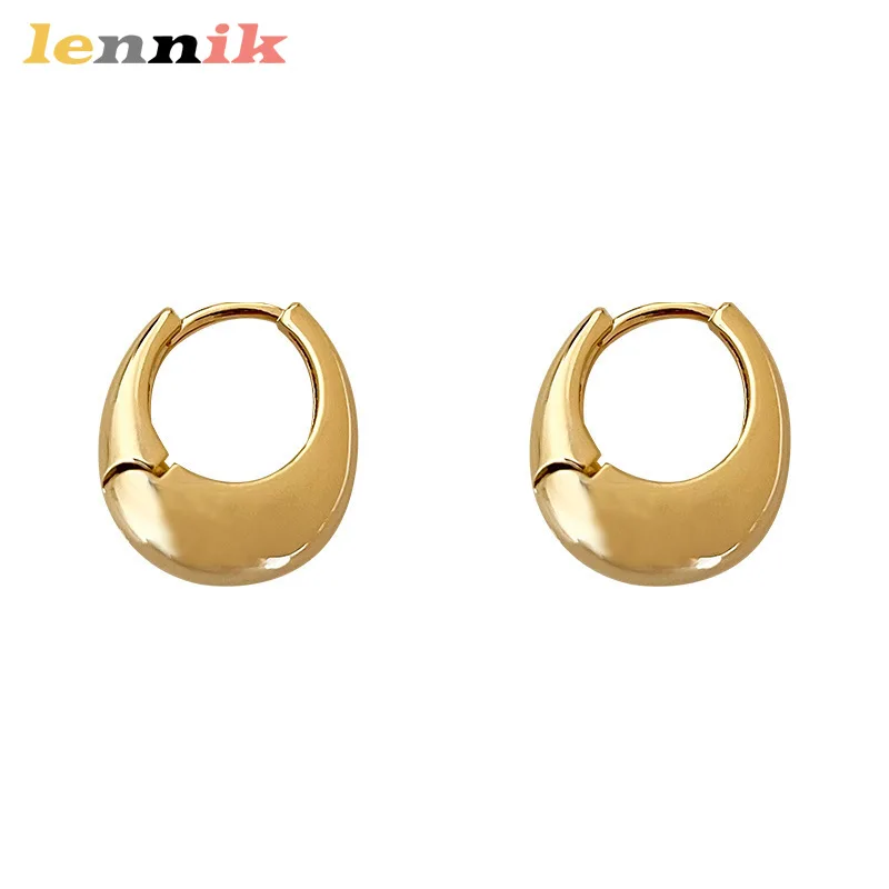 Oval Earrings with Sculpted Metal Design