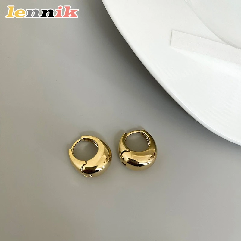 Oval Earrings with Sculpted Metal Design